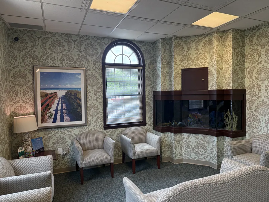 The waiting room aquarium beside a beach print