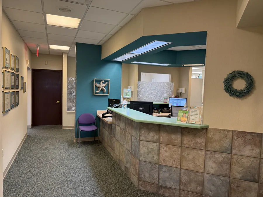 The front desk, with its teal wall and a starfish above the counter
